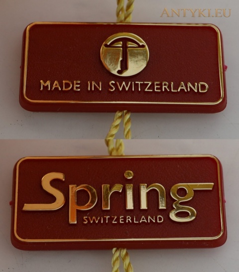 obie strony czerwonej metki Spring Switzerland i Made in Switzerland